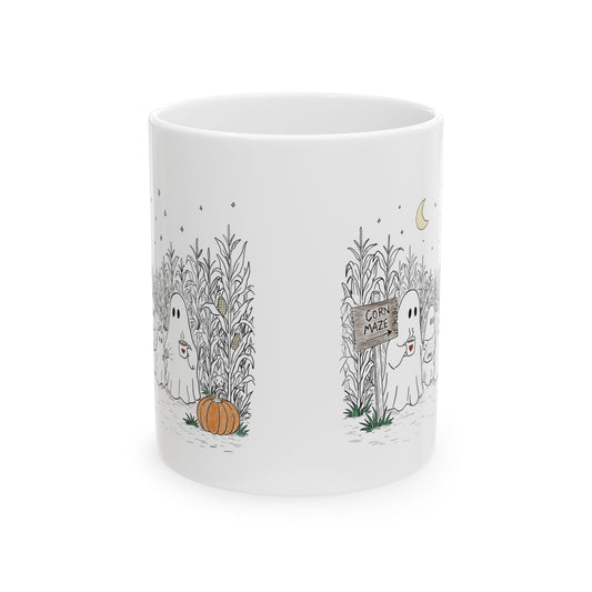 White ceramic coffee mug printed on both sides with a hand-drawn ghost family walking through a moonlit corn maze with warm drinks and a pumpkin, from The Story of the Ghost Chapter 2 collection.