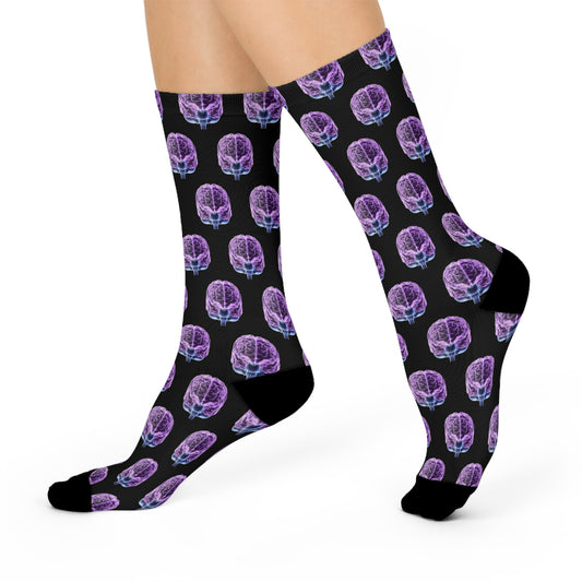 Black socks with purple brain pattern worn by a person on a white background