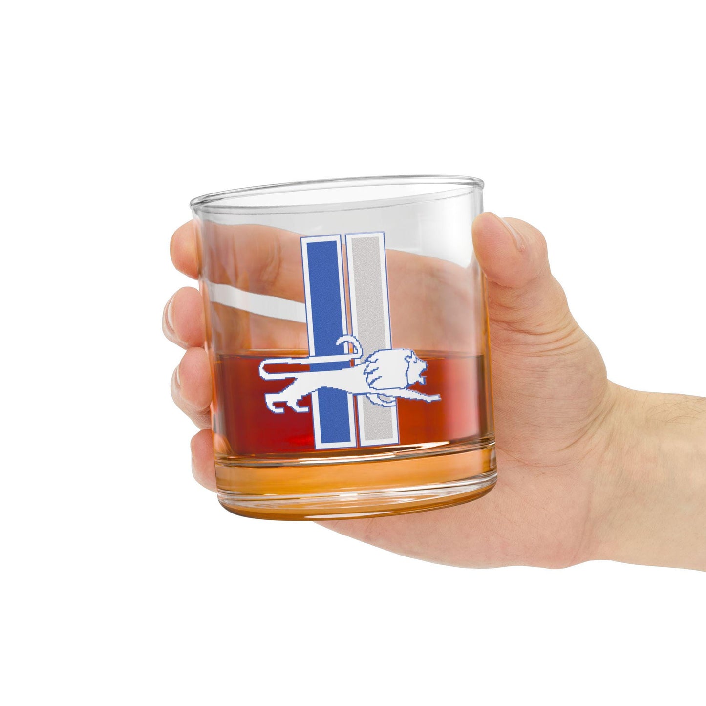 A clear rocks glass with a hand-drawn leaping lion design in blue and silver colors, representing the Detroit Lions.
