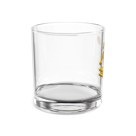 A clear glass rocks glass with a hand-drawn vintage design of the Pittsburgh Steelers logo playing with a football.