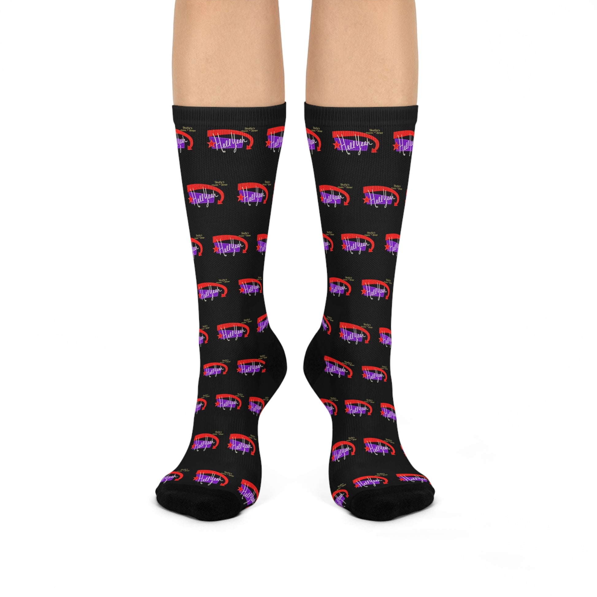 Black crew socks featuring a repeating Skully’s “Hell Yeah” inspired design in red and purple for concert and live music fans.