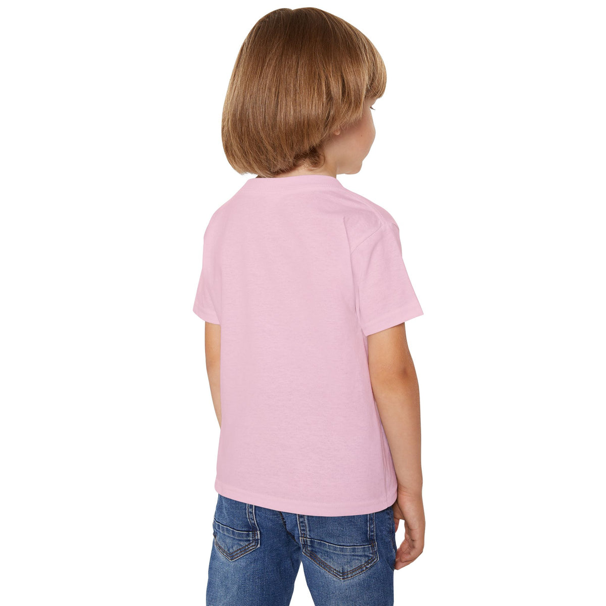Child wearing a pink tee shirt and blue jeans on a white background