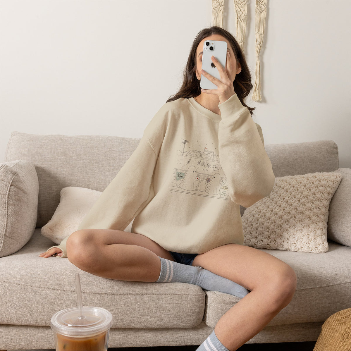 Cream crewneck sweatshirt featuring original cute ghost family football artwork from Friday Night Lights, Chapter 5 of The Story of the Ghost by Market Mafia Creations.