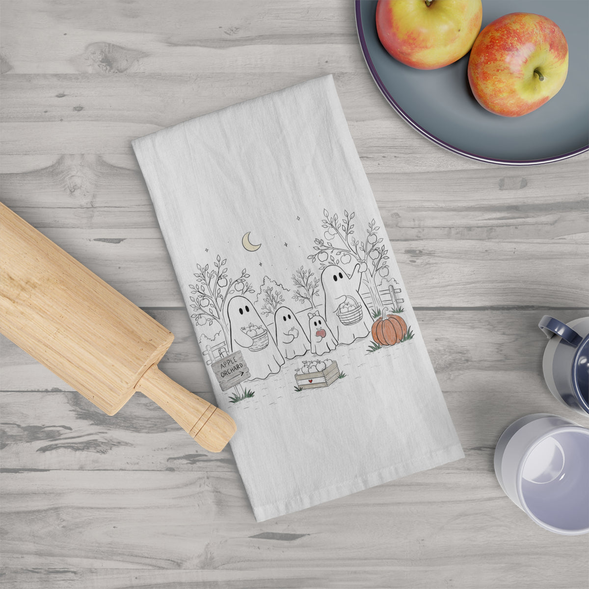 Cotton tea towel featuring a cute ghost family picking apples in an autumn orchard with baskets, trees, moon, pumpkin and fall details from The Story of the Ghost Chapter 4.
