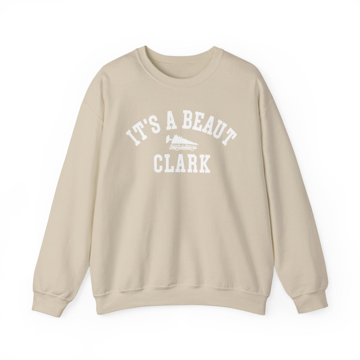 Sand color crewneck sweatshirt featuring white It’s a Beaut Clark lettering and a station wagon carrying a Christmas tree.