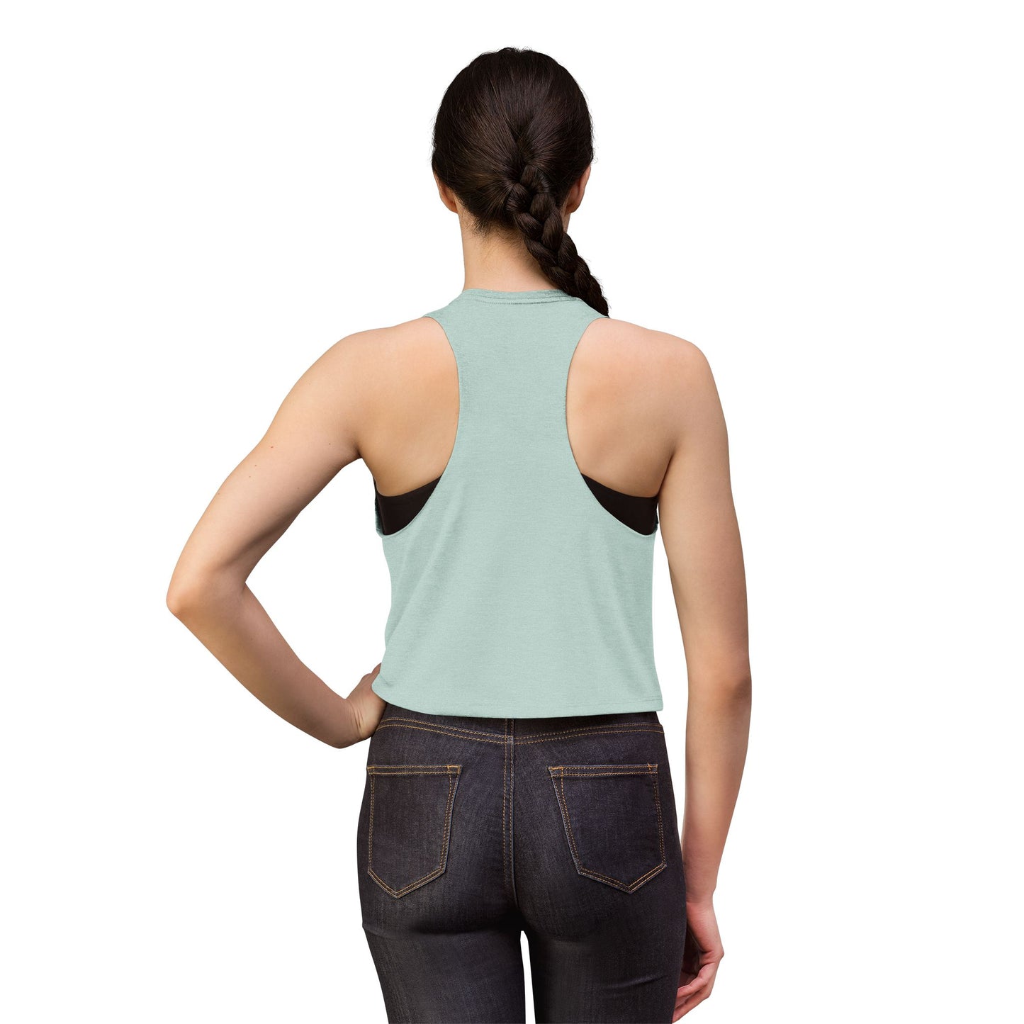 Person wearing a light green tank top with black accents and dark jeans on a white background