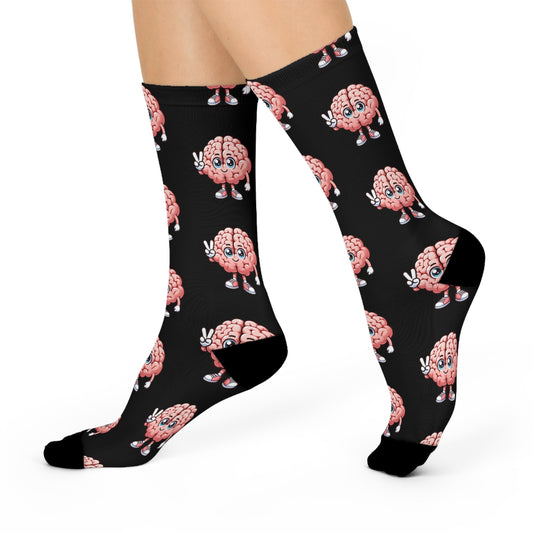 Black crew socks featuring cute pink cartoon brain characters with expressive faces and peace signs in a fun all-over pattern.