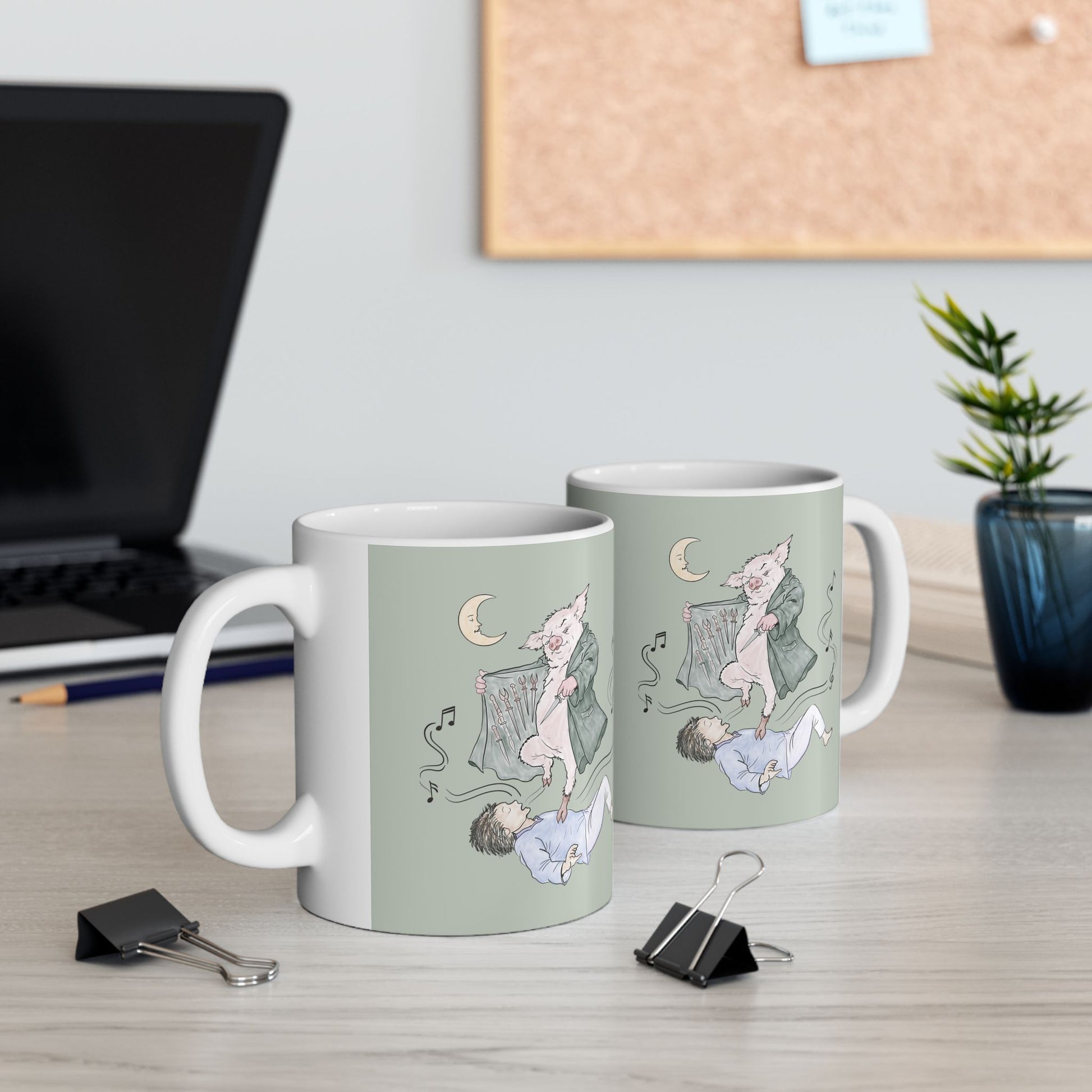 Sage green ceramic mug featuring original hand-drawn Guyute-inspired artwork with a surreal pig, musical mist, moon, and hidden song details.