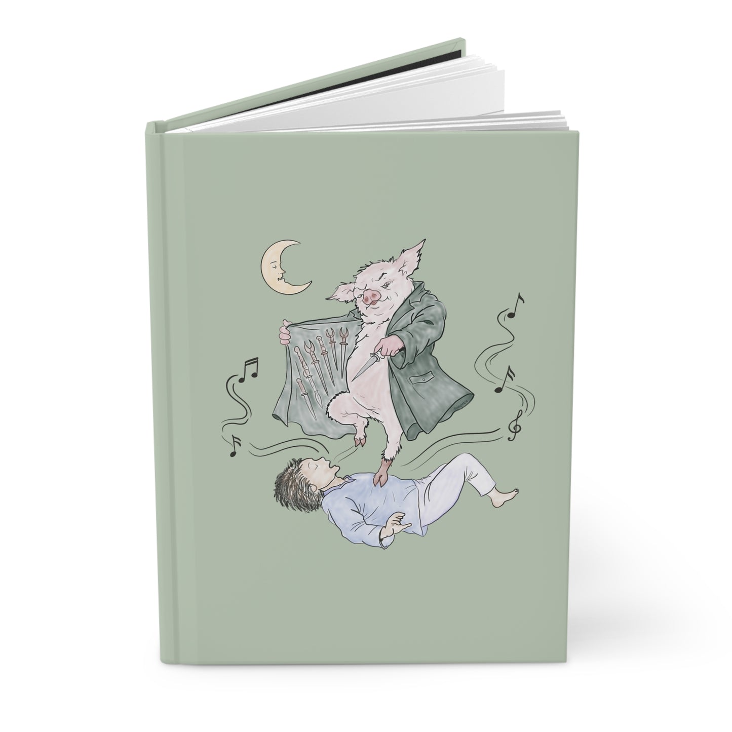 A hardcover journal with a sage green cover featuring a whimsical illustration of a pig in a coat floating above a sleeping person, with a crescent moon and musical notes.