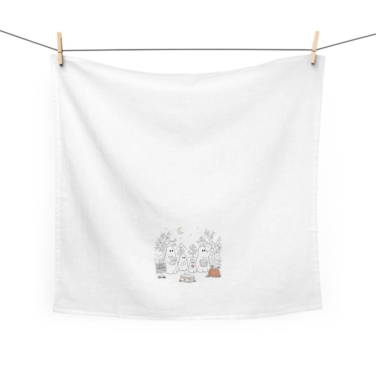 Cotton tea towel featuring a ghost family picking apples in an orchard with trees, baskets, pumpkin and moon from The Story of the Ghost Chapter 4.