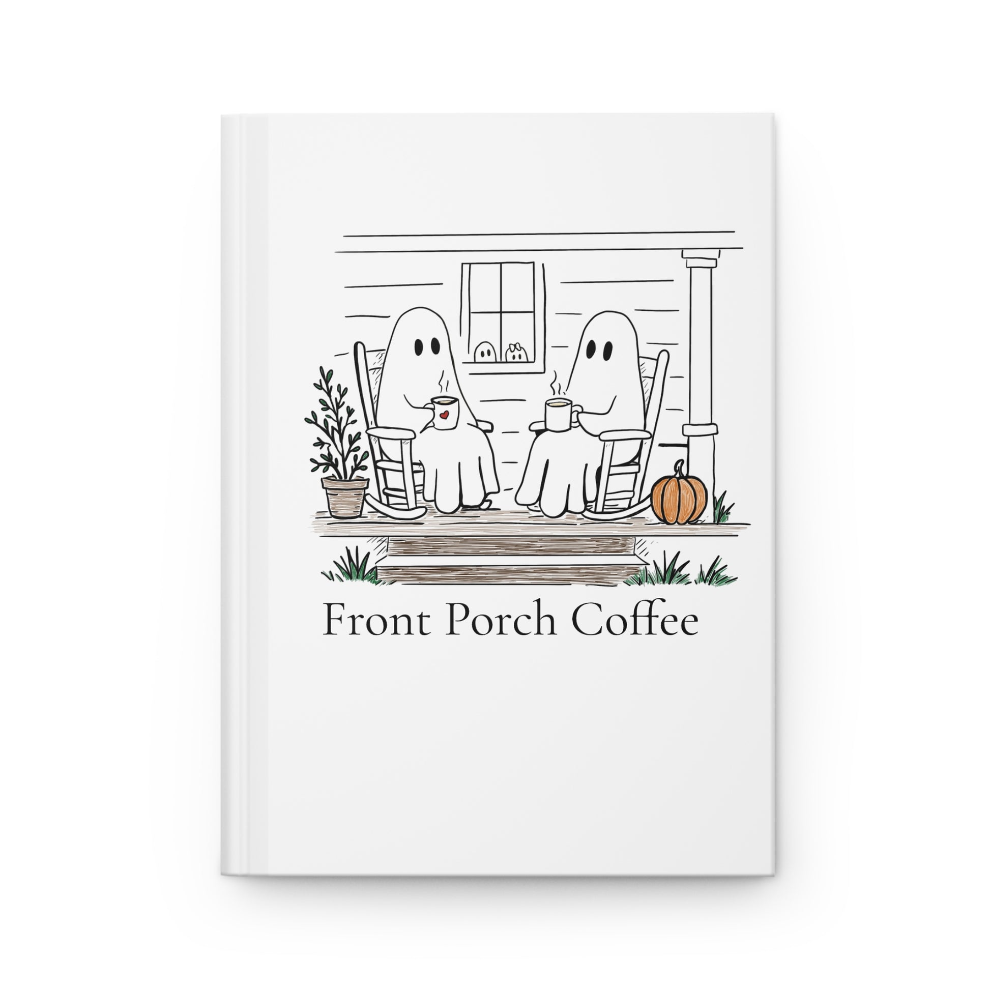 A white hardcover notebook with a black line art illustration of two ghosts sitting on a front porch rocking chairs drinking coffee, with a small orange pumpkin and the text 'Front Porch Coffee' printed below.
