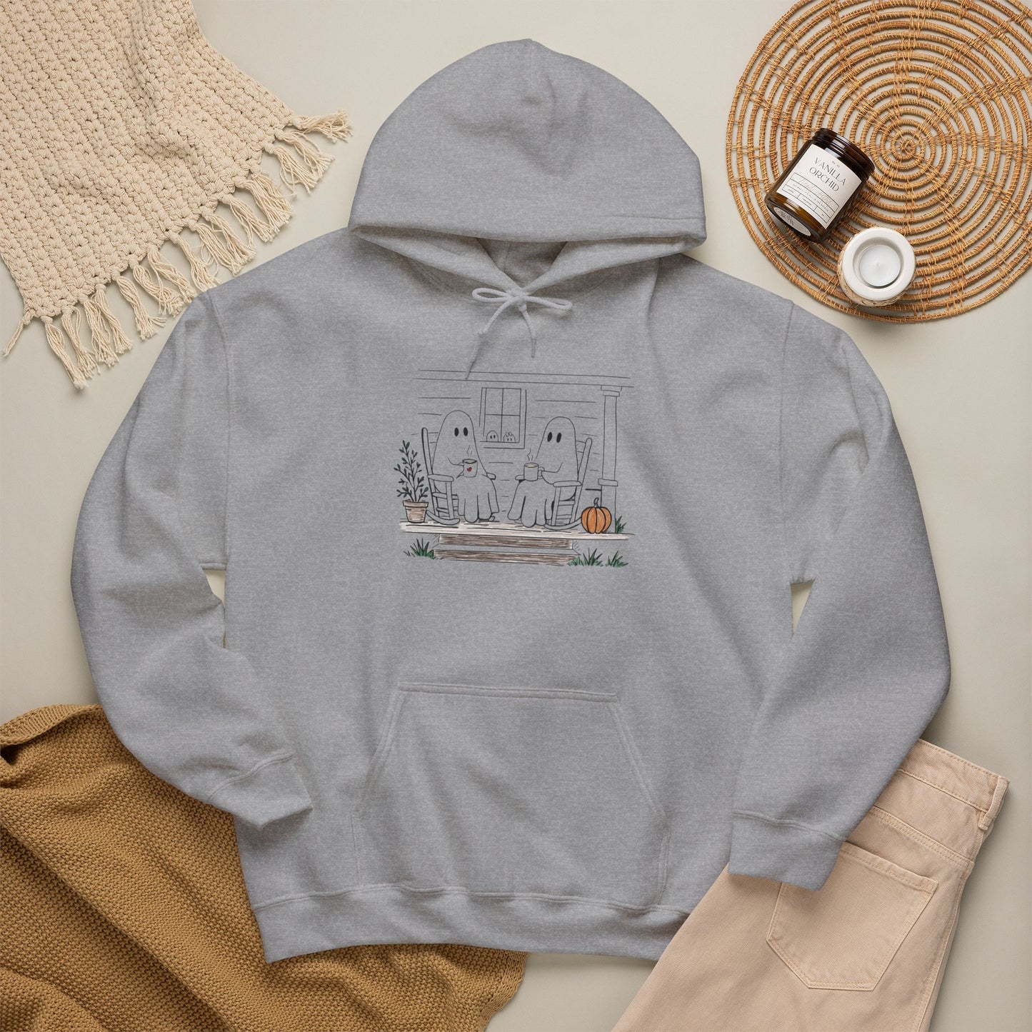Gray hoodie with a graphic design on a neutral background