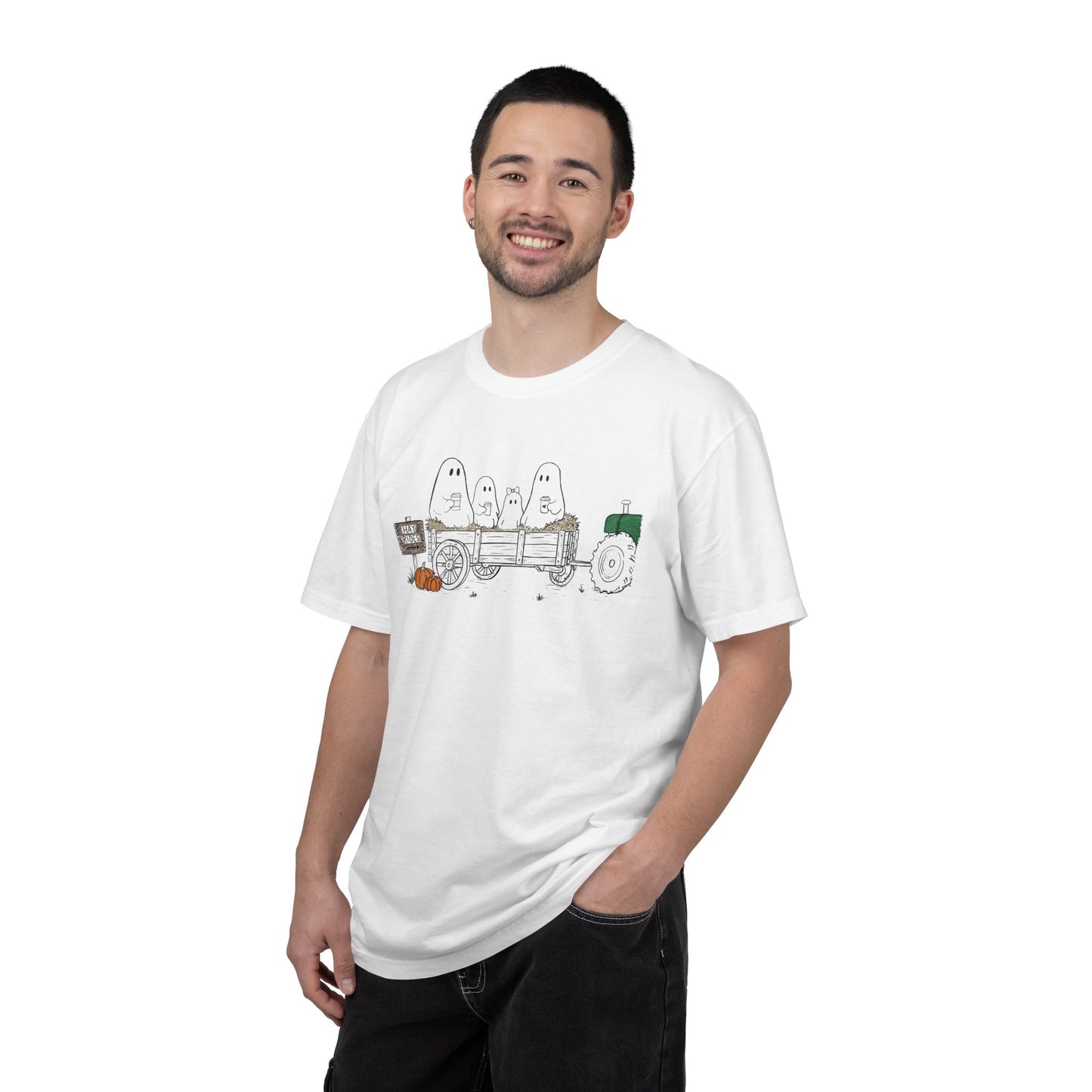 Comfort Colors white t-shirt featuring a hand-drawn ghost family riding in a hay wagon with pumpkins, coffee mugs, and a vintage tractor from The Story of the Ghost Chapter 1 collection.