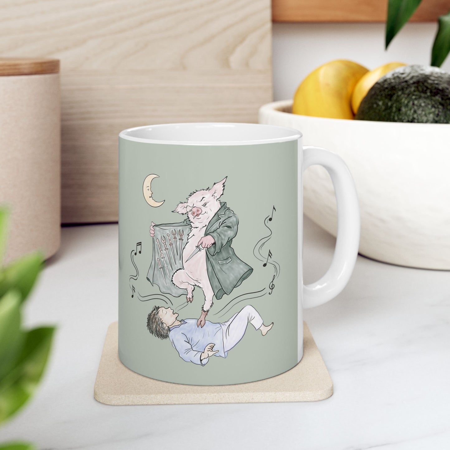 Sage green ceramic mug featuring original hand-drawn Guyute-inspired artwork with a surreal pig, musical mist, moon, and hidden song details.