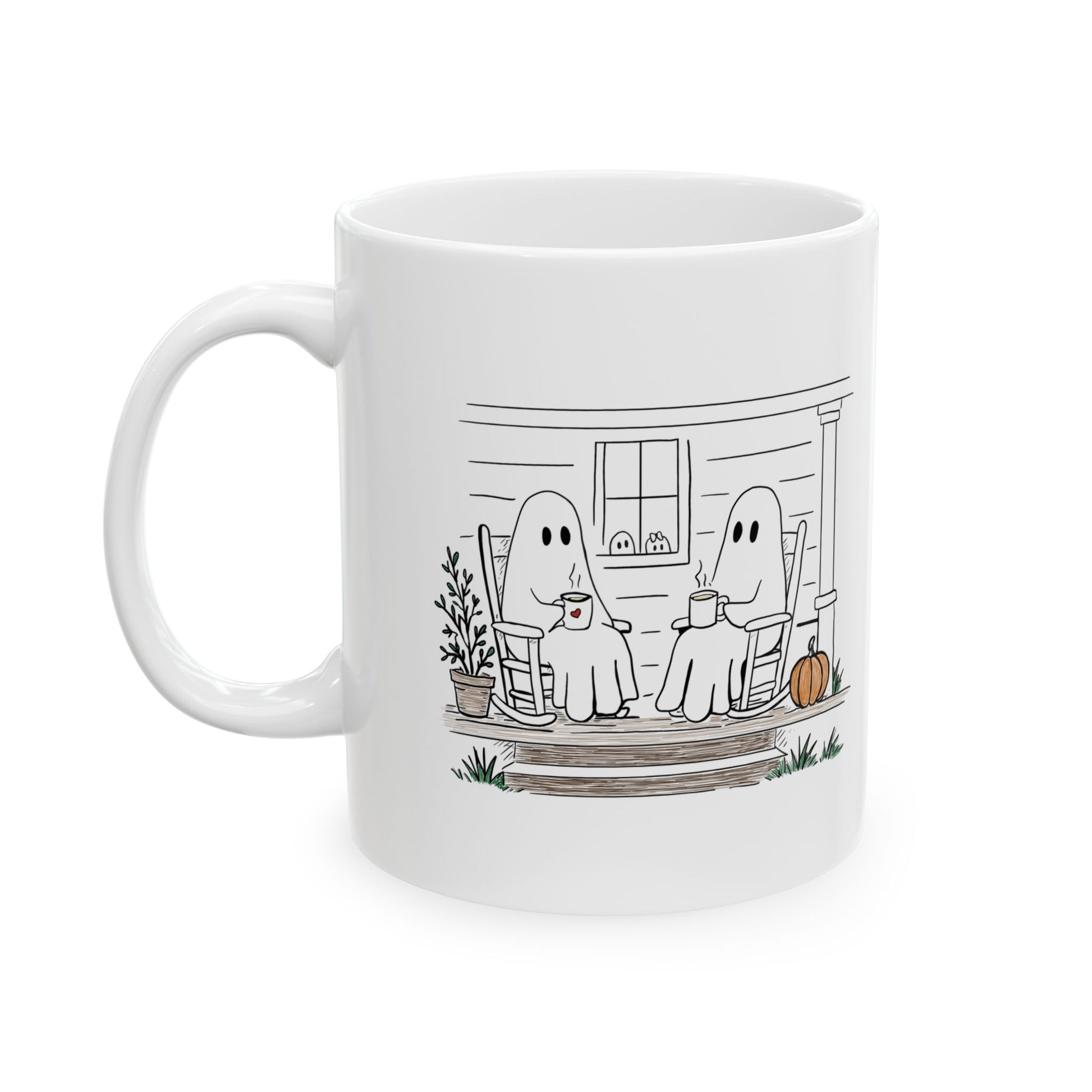 White ceramic mug featuring a hand-drawn ghost family sitting on a front porch in rocking chairs with coffee, with two little ghosts peeking through the window and subtle fall color accents.