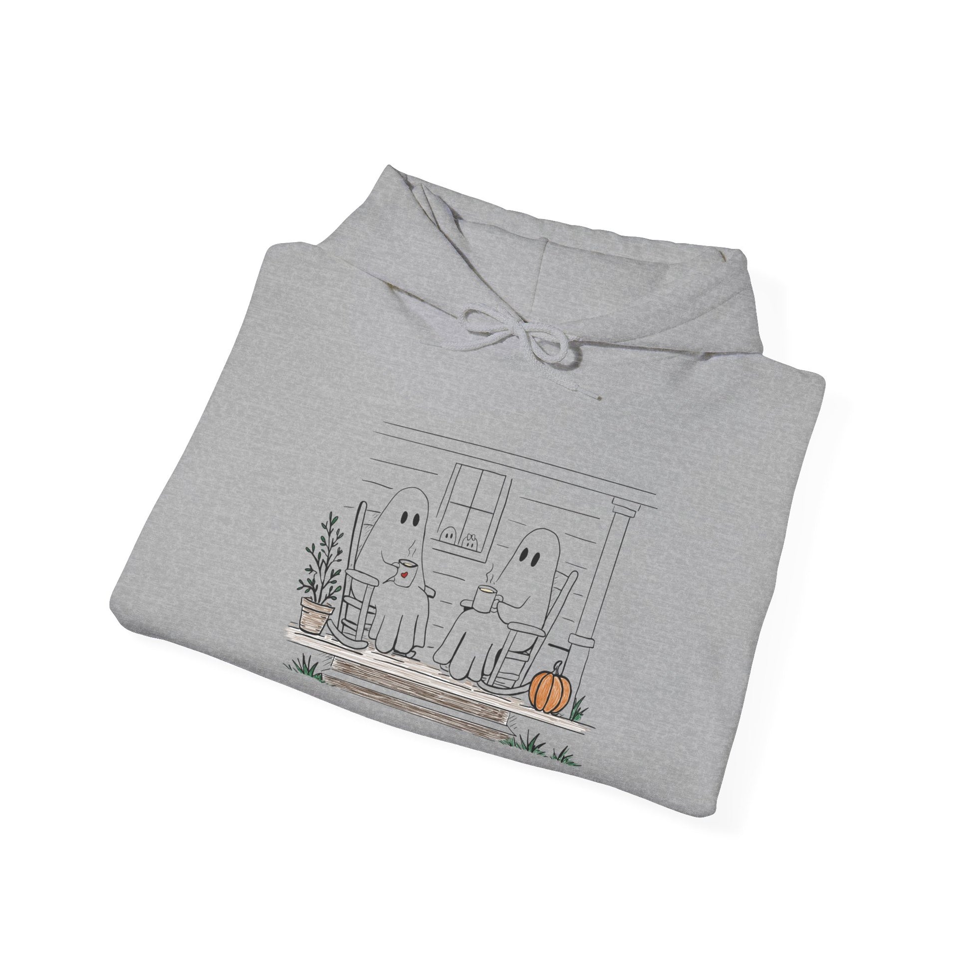 Pullover hoodie featuring a hand-drawn ghost family enjoying coffee in rocking chairs on a front porch, with two little ghosts peeking through the window, a pumpkin, and subtle fall color accents.
