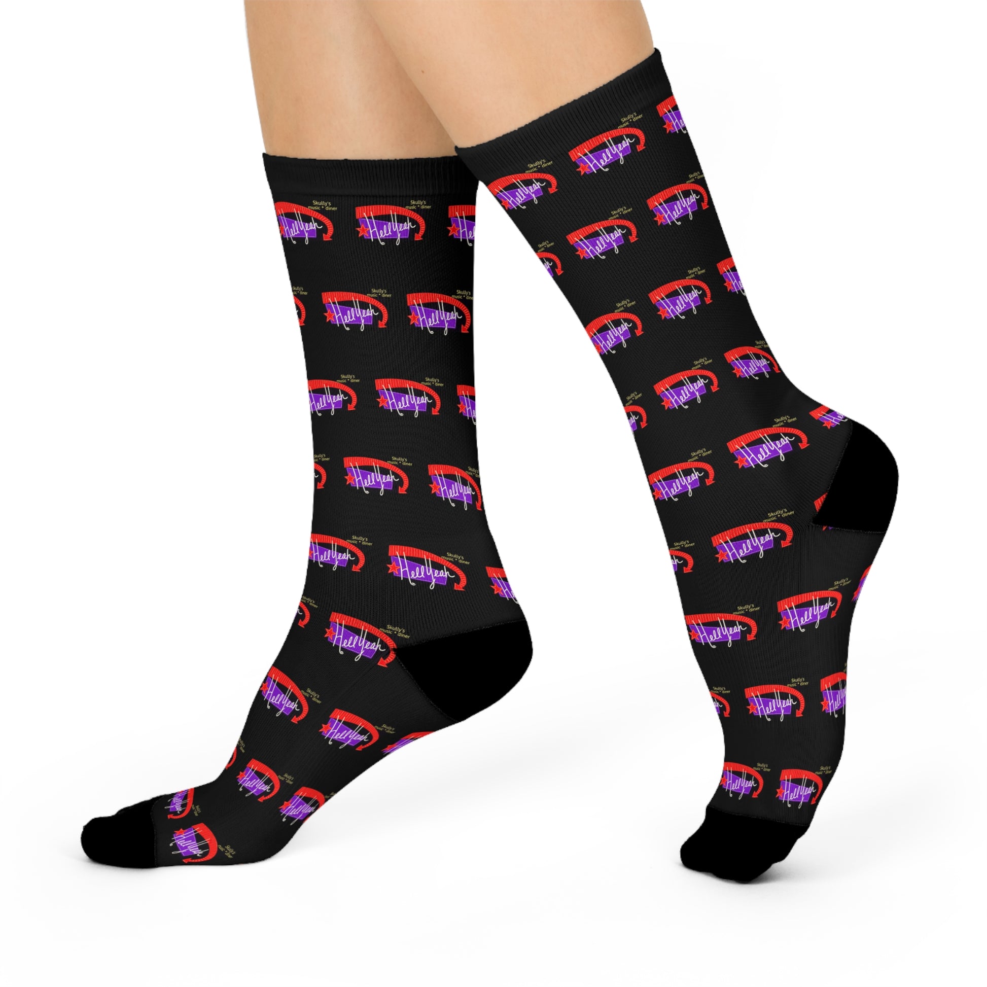 Black crew socks featuring a repeating Skully’s “Hell Yeah” inspired design in red and purple for concert and live music fans.