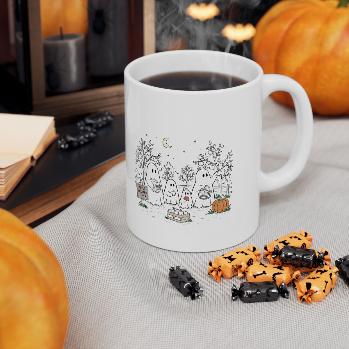 Coffee mug featuring a cute ghost family picking apples in an autumn orchard with baskets, pumpkin, trees and moon from The Story of the Ghost Chapter 4.