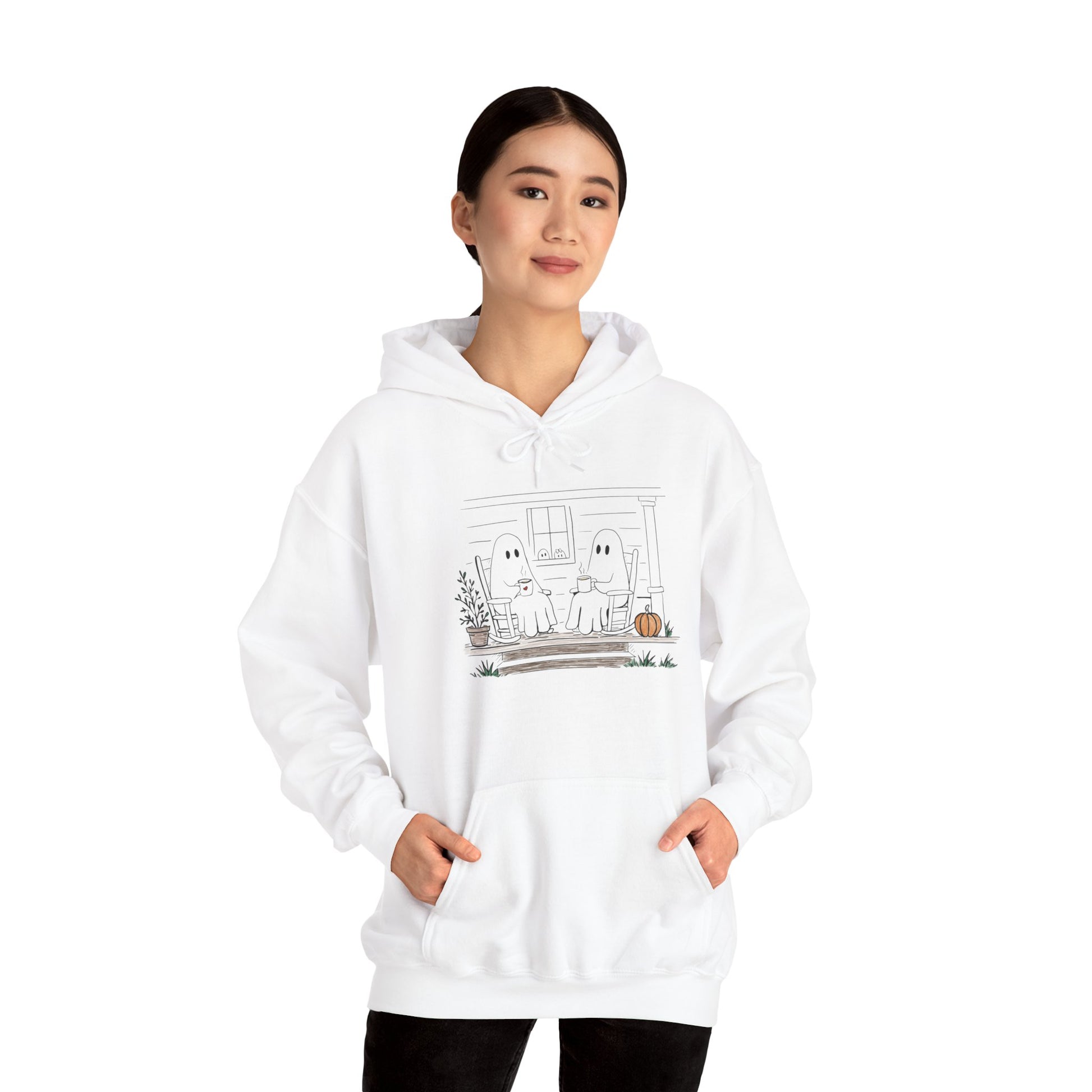 Pullover hoodie featuring a hand-drawn ghost family enjoying coffee in rocking chairs on a front porch, with two little ghosts peeking through the window, a pumpkin, and subtle fall color accents.