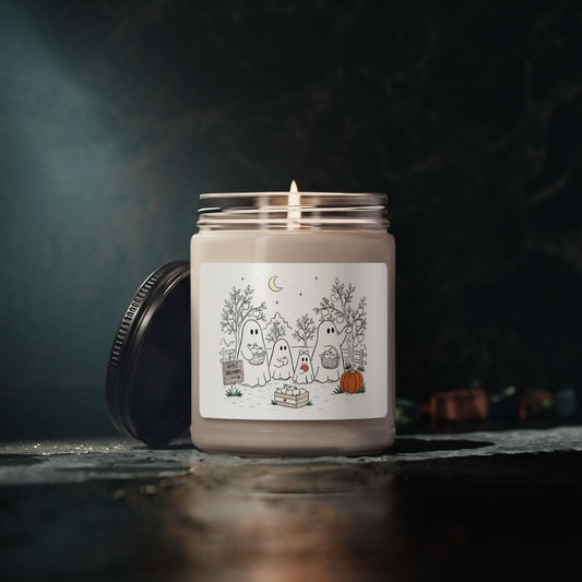 Apple Harvest soy candle featuring the ghost family picking apples in the Apple Orchard artwork from Chapter 4 of The Story of the Ghost.