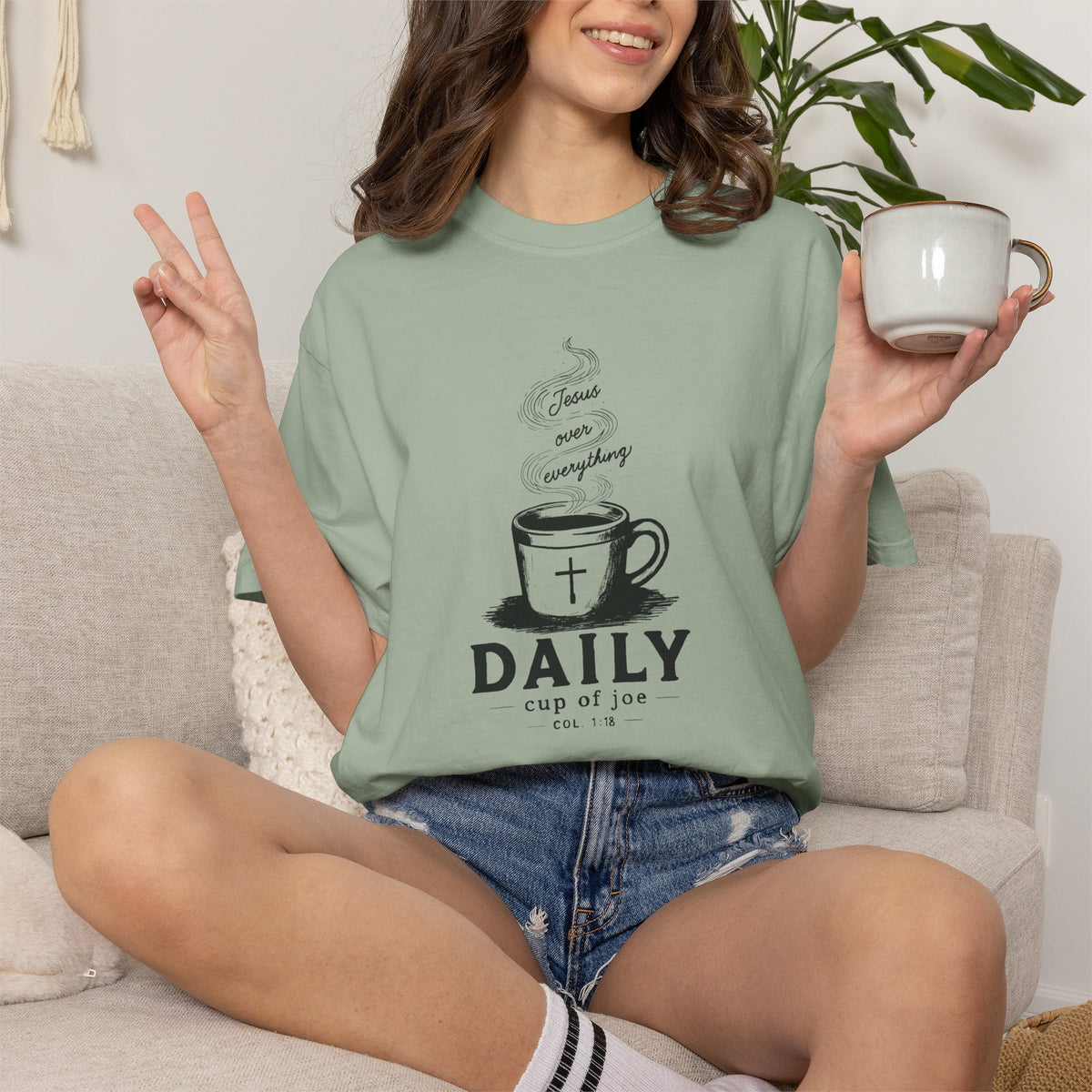 Sage Comfort Colors Christian T-shirt featuring original Daily Cup of JOE Jesus Over Everything coffee cup artwork inspired by Colossians 1:18.