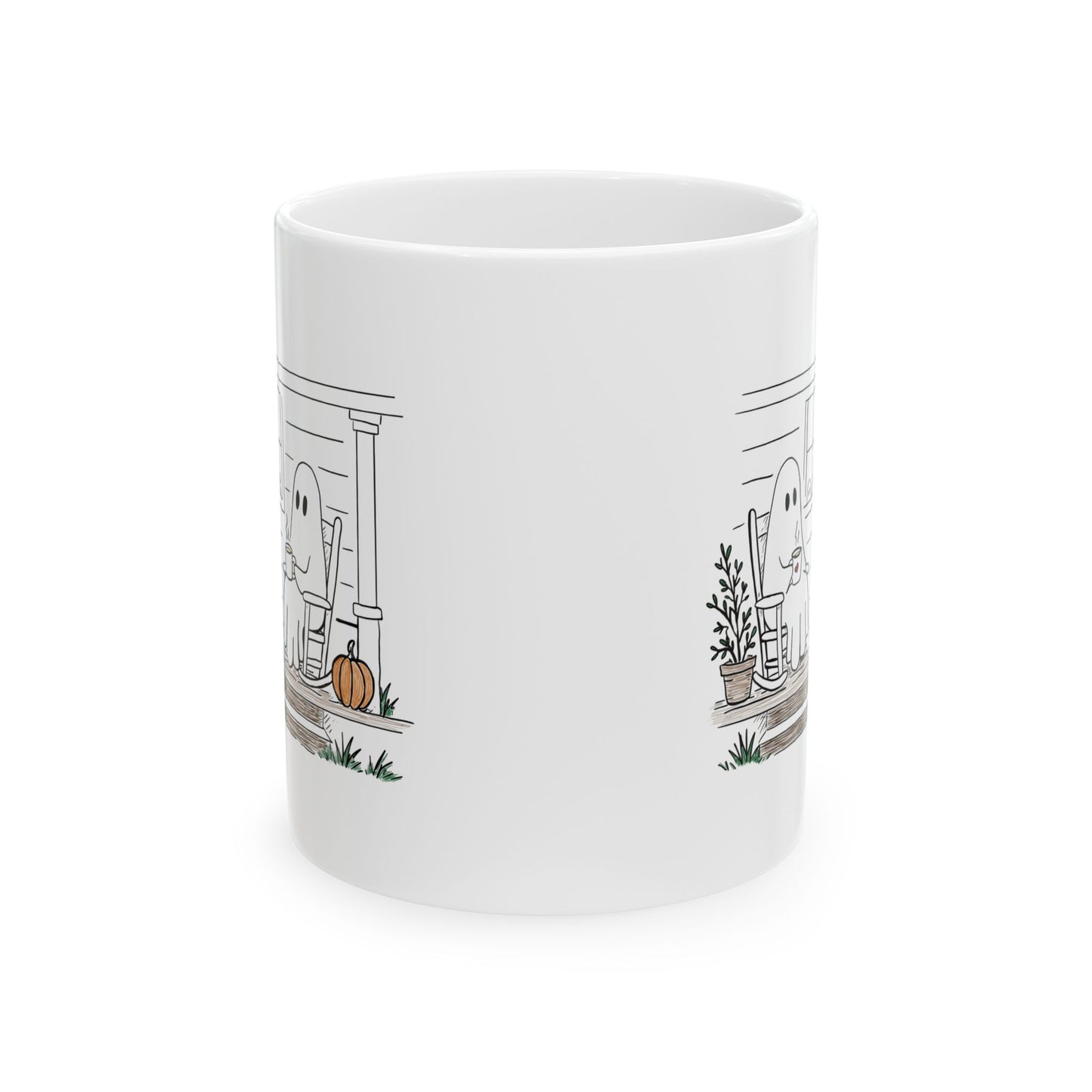 White ceramic mug featuring a hand-drawn ghost family sitting on a front porch in rocking chairs with coffee, with two little ghosts peeking through the window and subtle fall color accents.