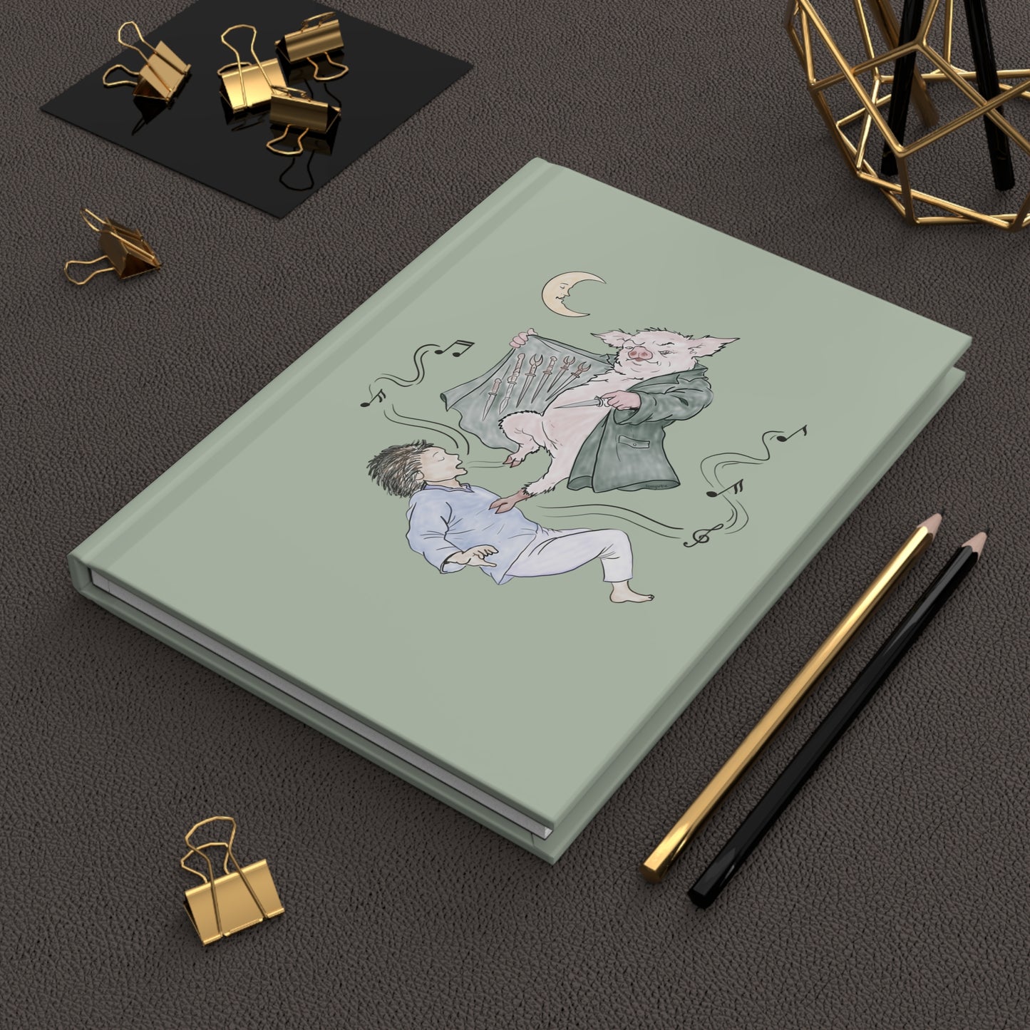 Hardcover journal featuring original hand-drawn Guyute-inspired artwork with a surreal pig, musical mist, moon, and muted storybook colors.