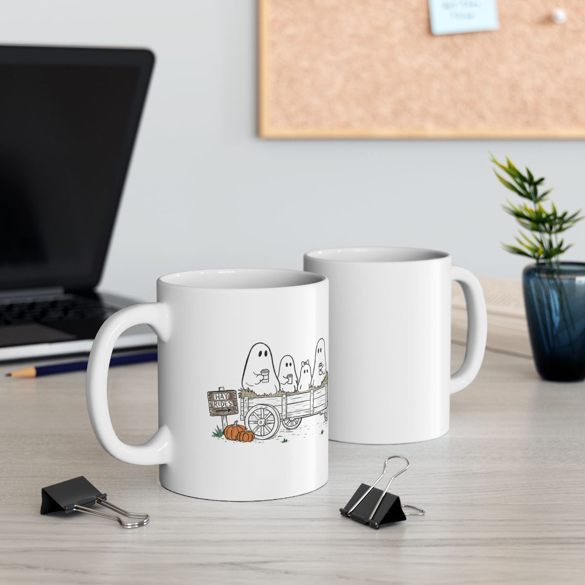 Ghost family riding in a hay wagon with pumpkins and coffee mugs, featured on a white ceramic coffee mug from The Story of the Ghost Chapter One: Hayrides fall collection by Market Mafia Creations.
