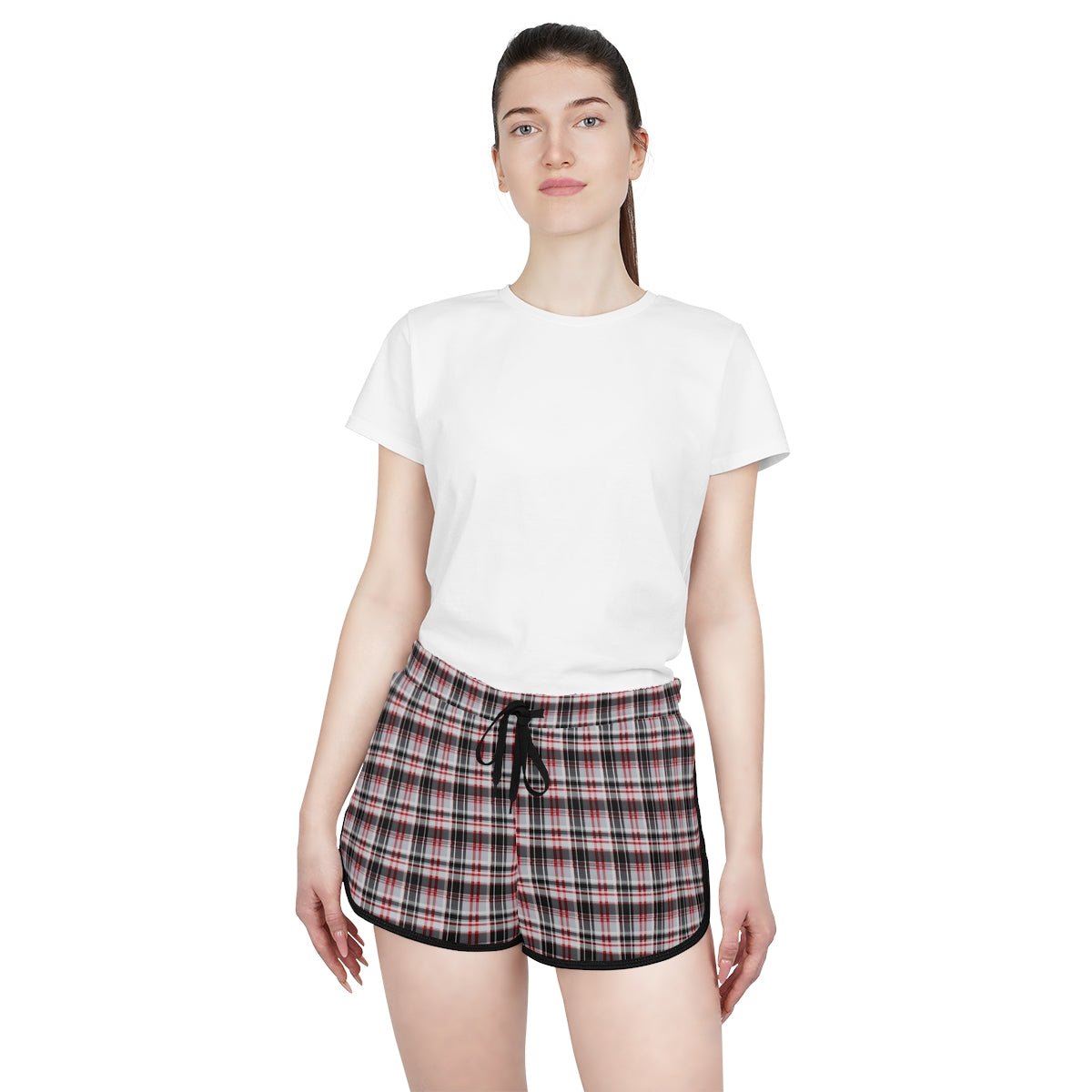 Woman wearing a white t-shirt and plaid shorts on a white background