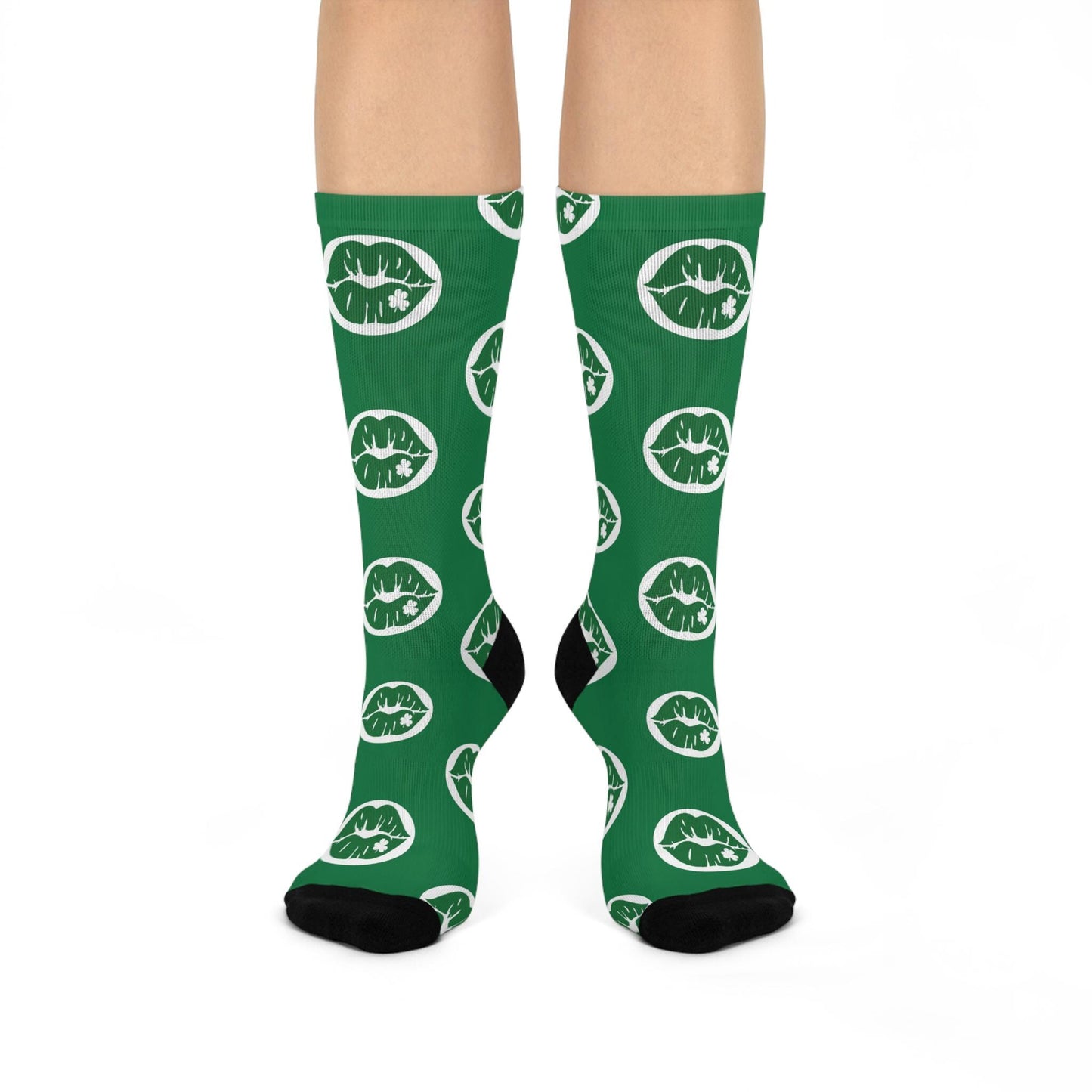 Green socks with white lip prints on a white background