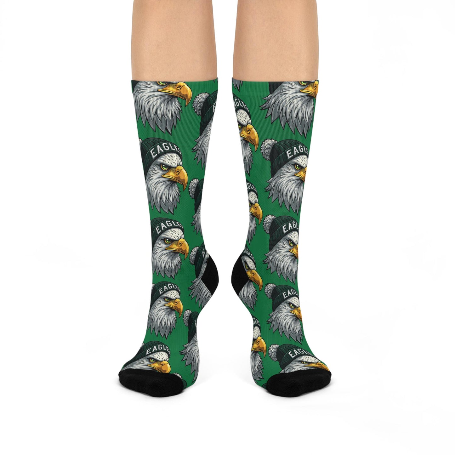 A pair of green cushioned crew socks with an all-over print of eagle designs.