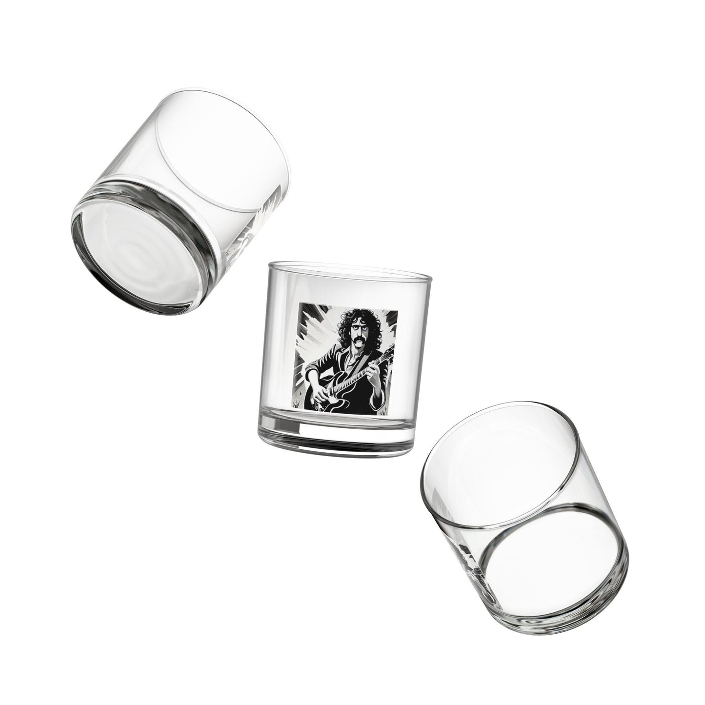 Set of three clear glass tumblers with one featuring an engraved image on a white background