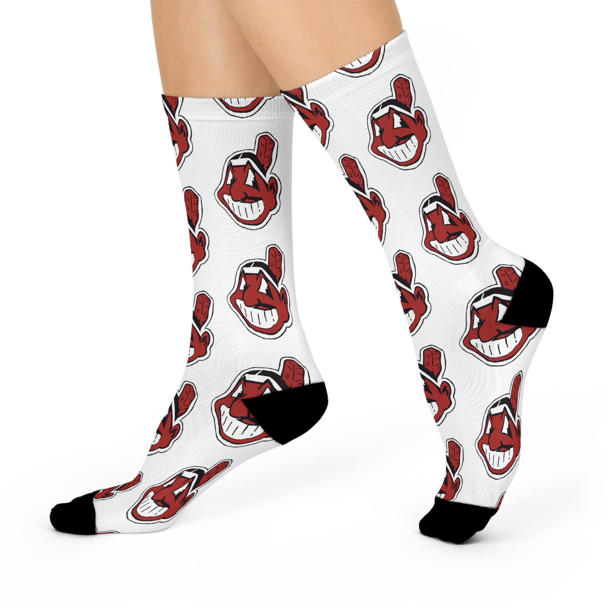 White socks with red and black logo pattern worn by a person on a white background
