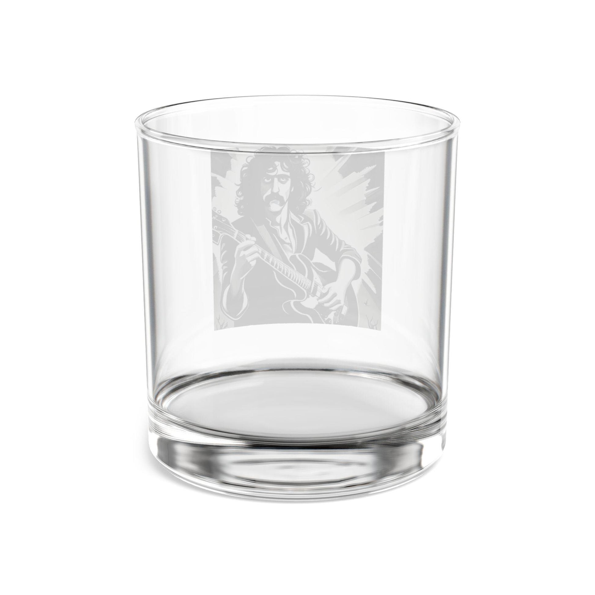 Clear glass tumbler with engraved design on a white background
