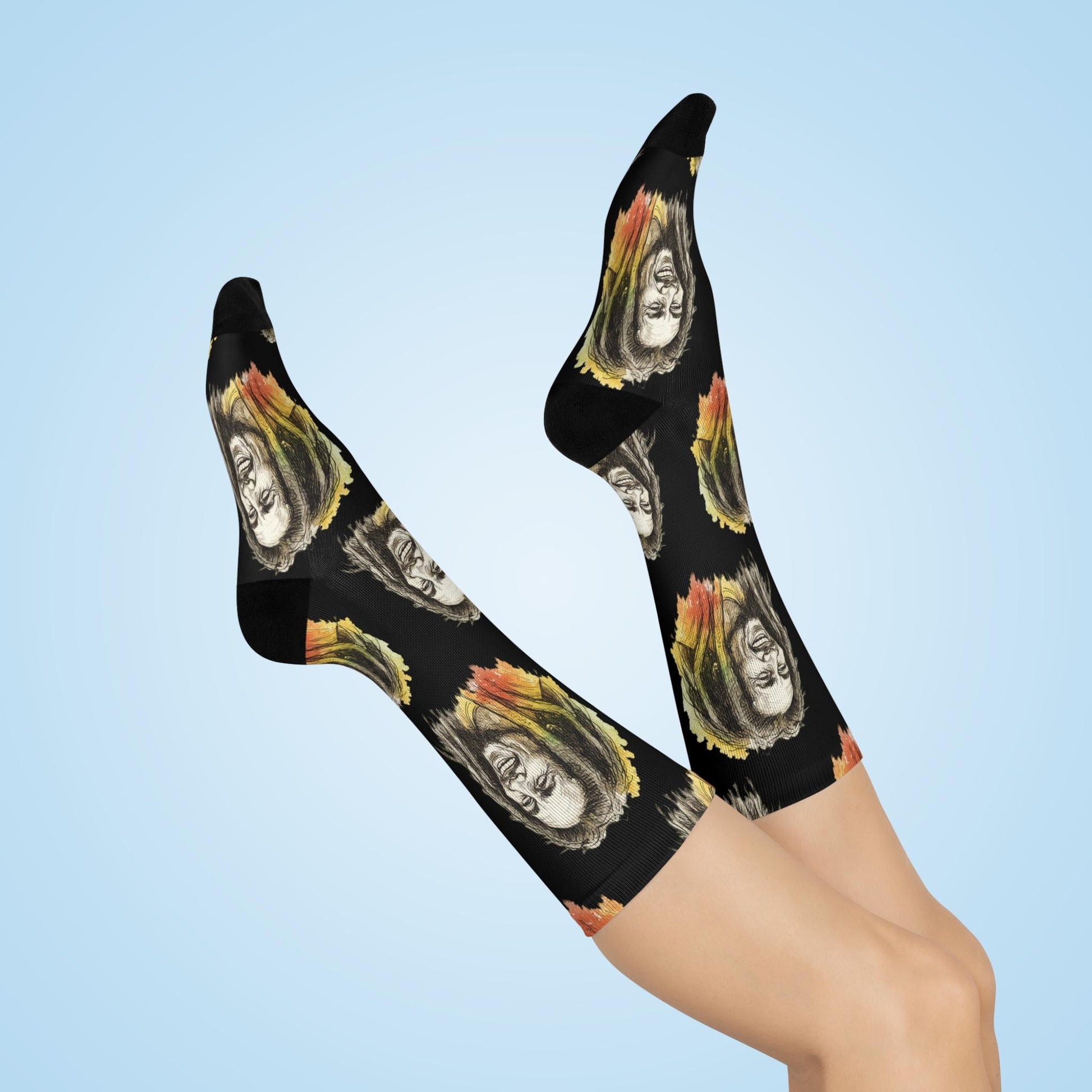 Black knee-high socks with a portrait pattern on a light blue background